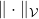 \|\cdot\|_{\mathcal{V}}